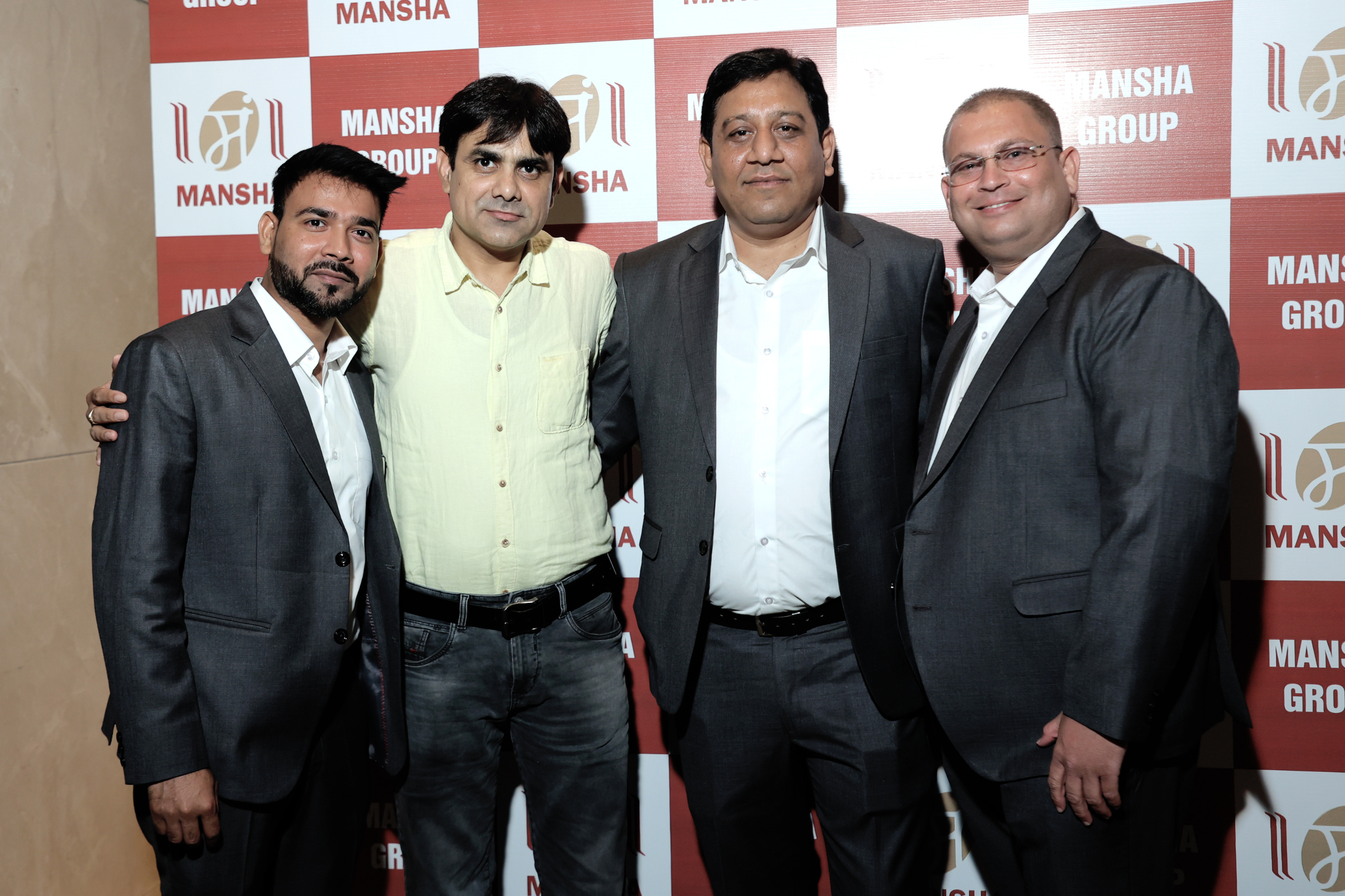 Channel partners at Mansha backdrop